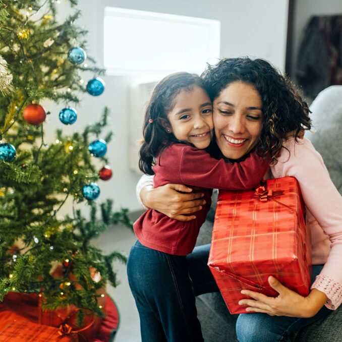 How much should you spend during the holidays-girl holding gift