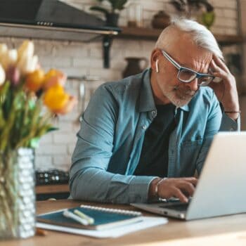 Man using laptop at table