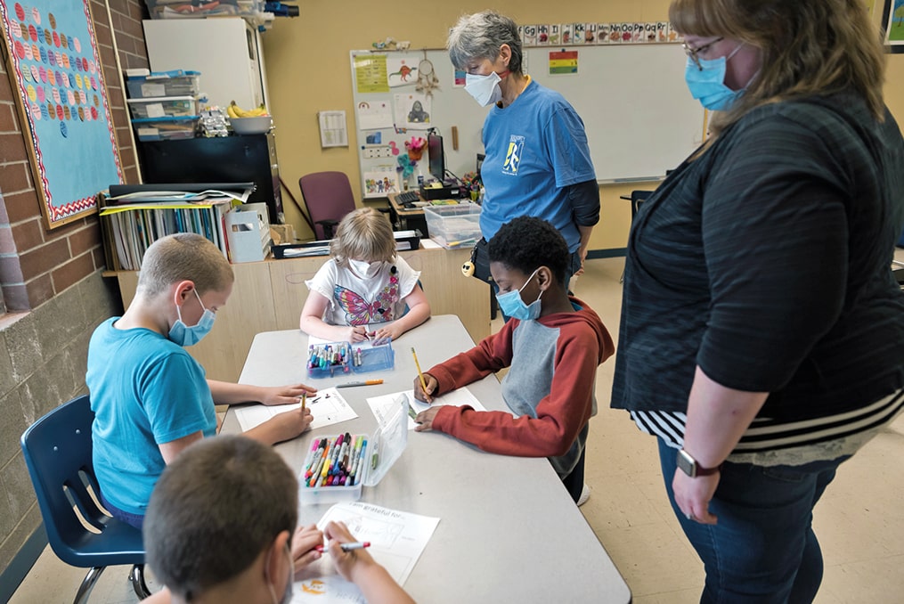 Serendipity Center—helping kids overcome challenges to lead happy and healthy lives-teachers guiding students in class