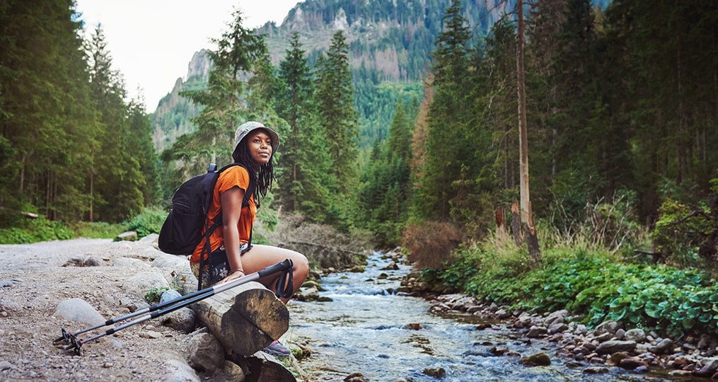 improve your finances by understanding where to start-ebook cover photo-woman sitting near river