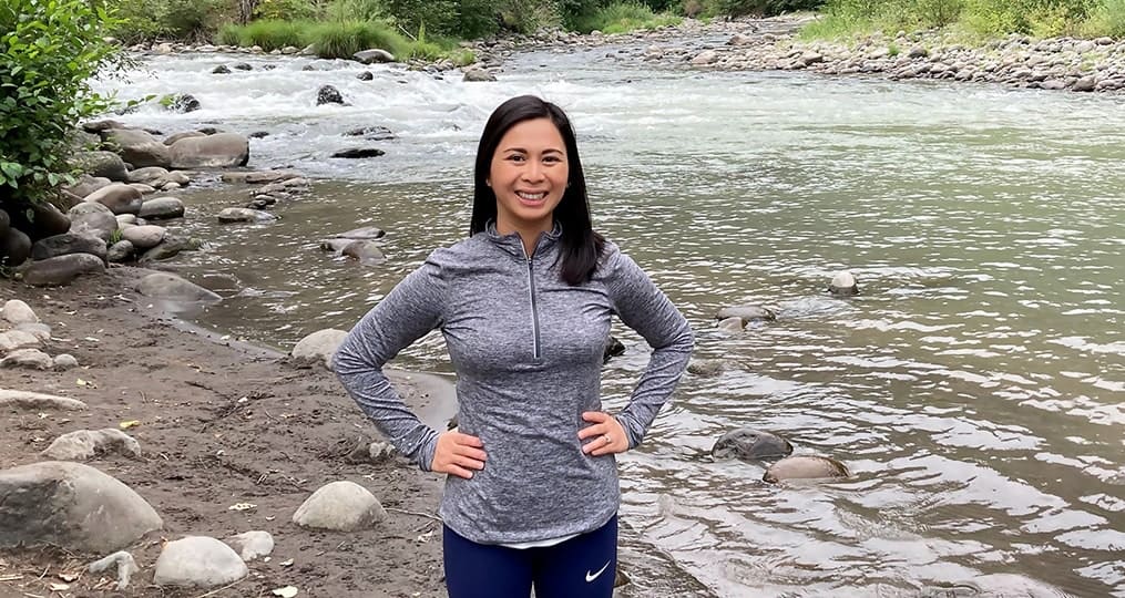 kristine robinson employee spotlight-kristine hiking at the river
