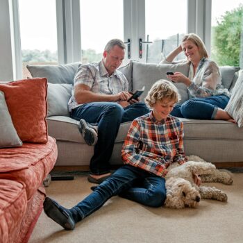 raising smart spenders and savers-family sitting in the living room