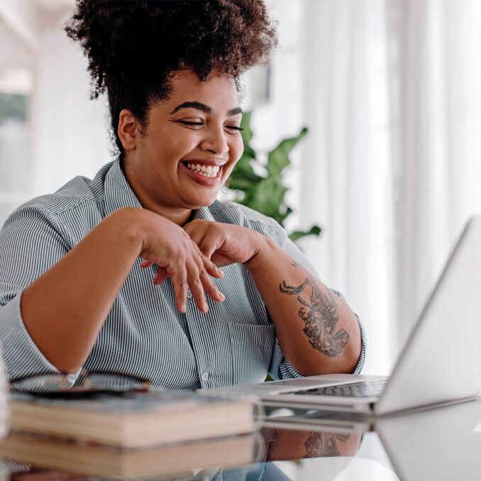 relaunching your career with a returnship-woman sitting at her desk taking an interview