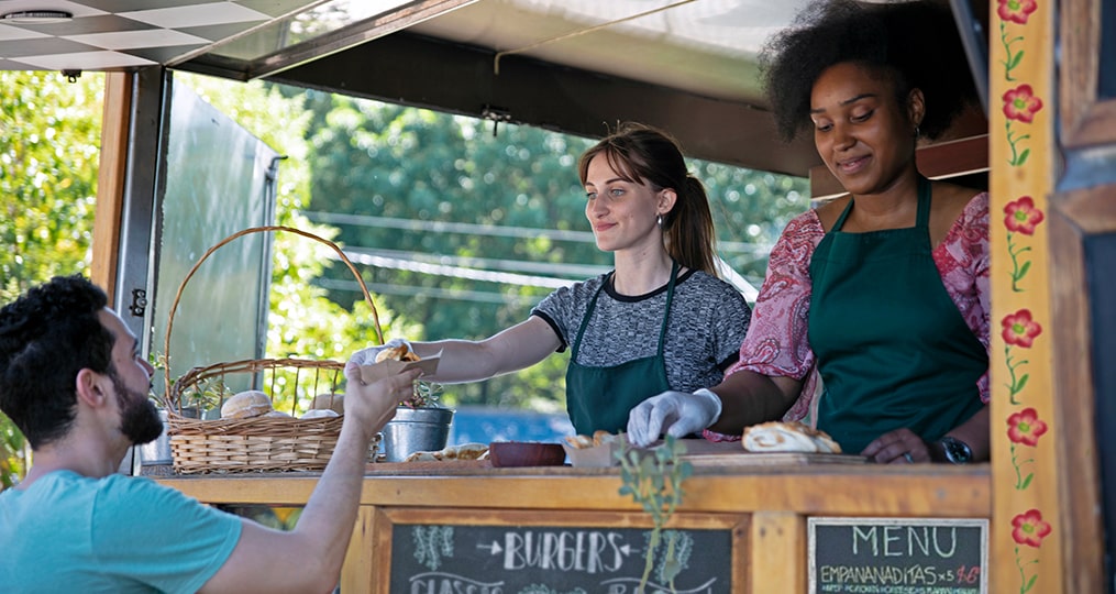 should you invest in the family entrepreneur-two women working at a local food cart