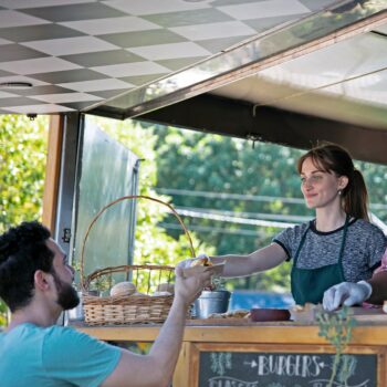should you invest in the family entrepreneur-two women working at a local food cart