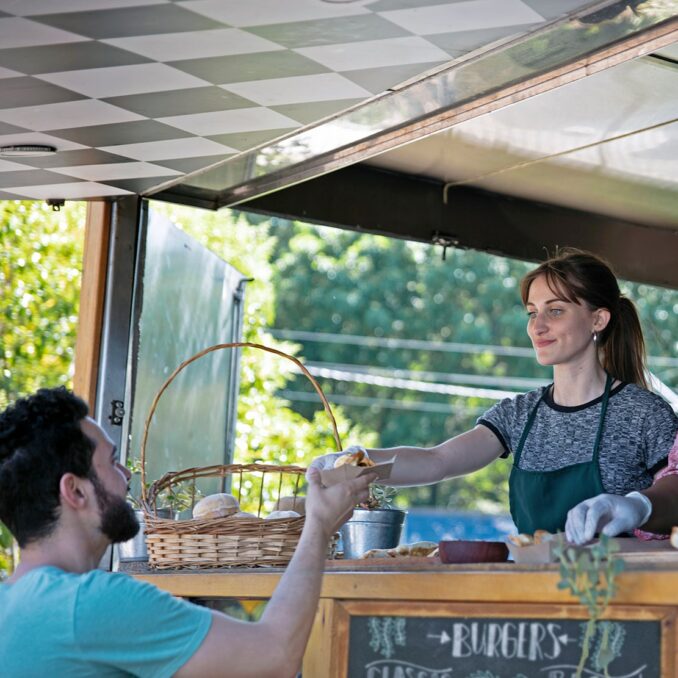 should you invest in the family entrepreneur-two women working at a local food cart