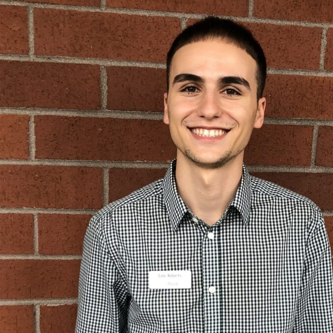 spotlight interview with Cole Roberts-Cole roberts headshot outside OnPoint 205 Place Branch
