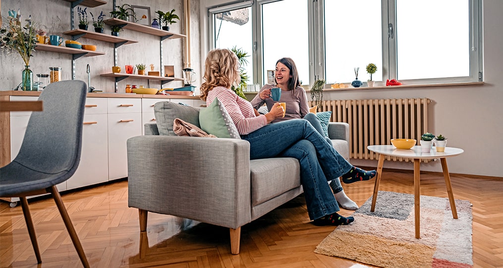 the real cost of free apps-two women sitting on a couch talking