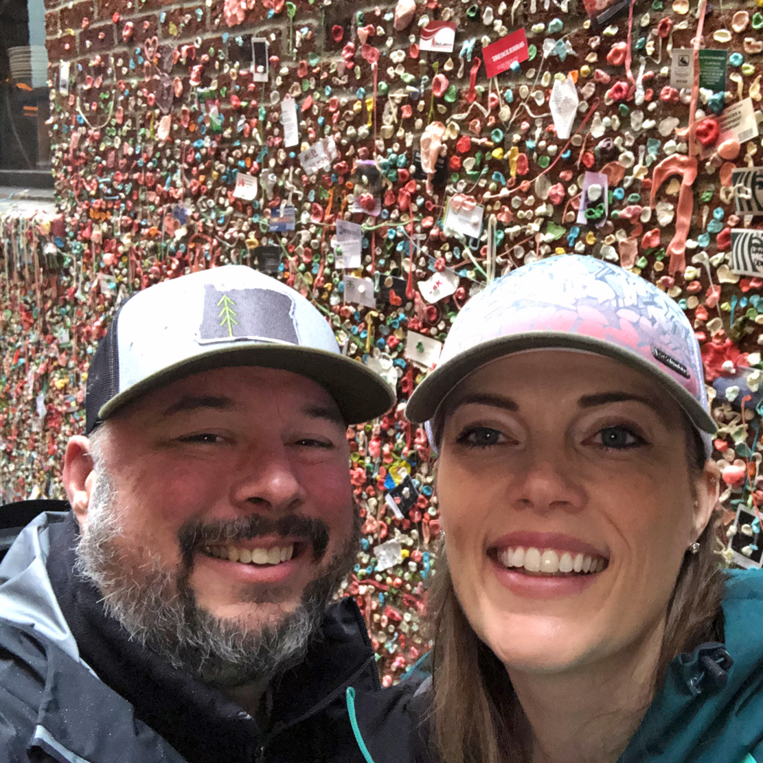 Heather Kesterson Employee Spotlight_Heather and her partner in front of gum wall