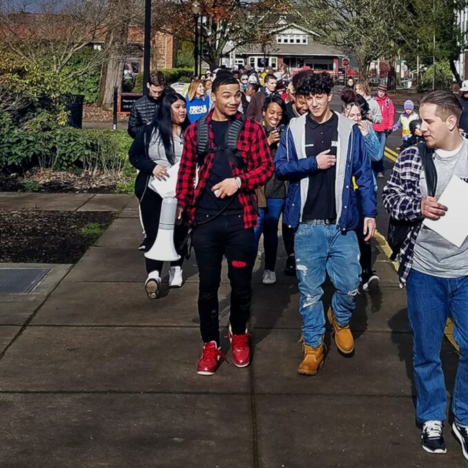 POIC + RAHS_large group of students walking down the street in Portland Oregon