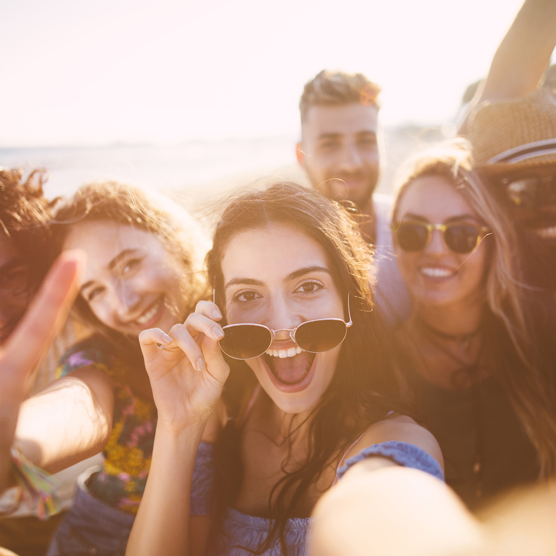 group of friends selfie at the beach