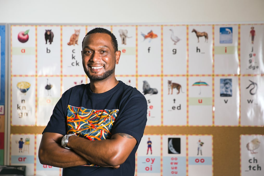 2021 Educator of the Year Lionel Clegg prepares students for life-Lionel standing in first grade classroom