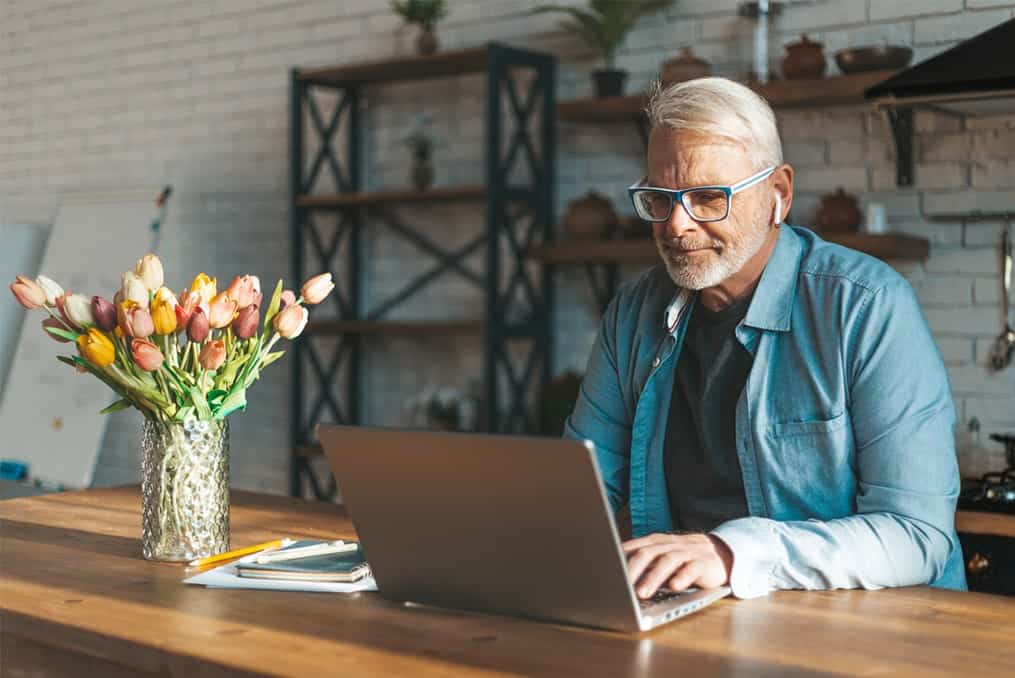 Man using laptop at table