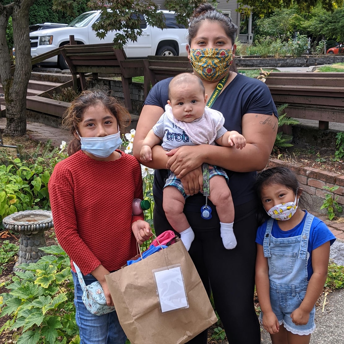 giving tuesday Rose Haven feature-mother and her three children receiving support from local non-profit