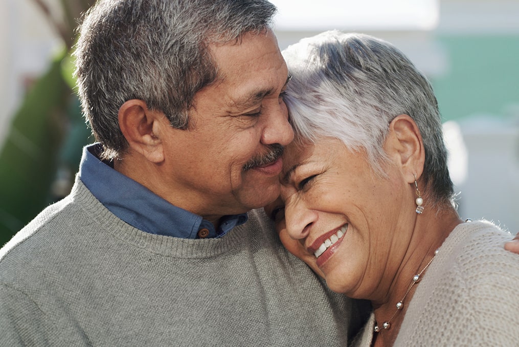 What to Do If You're Not on Track for Retirement_senior couple hugging and smiling