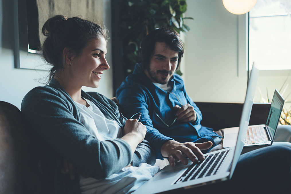 couple is now looking at her computer together