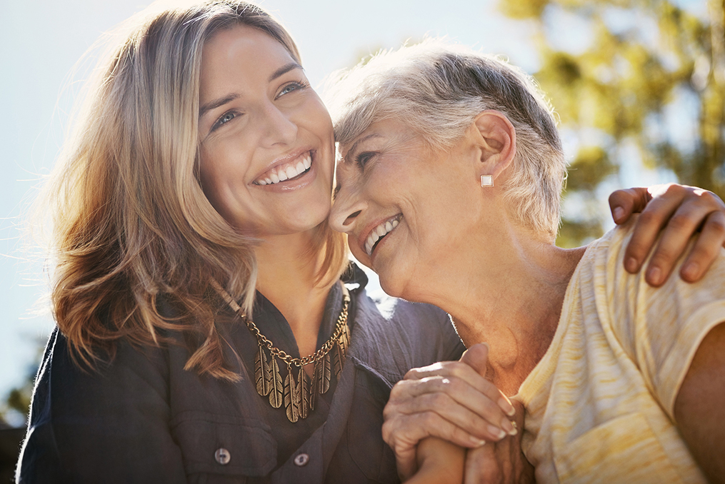 middle age woman embracing her mother