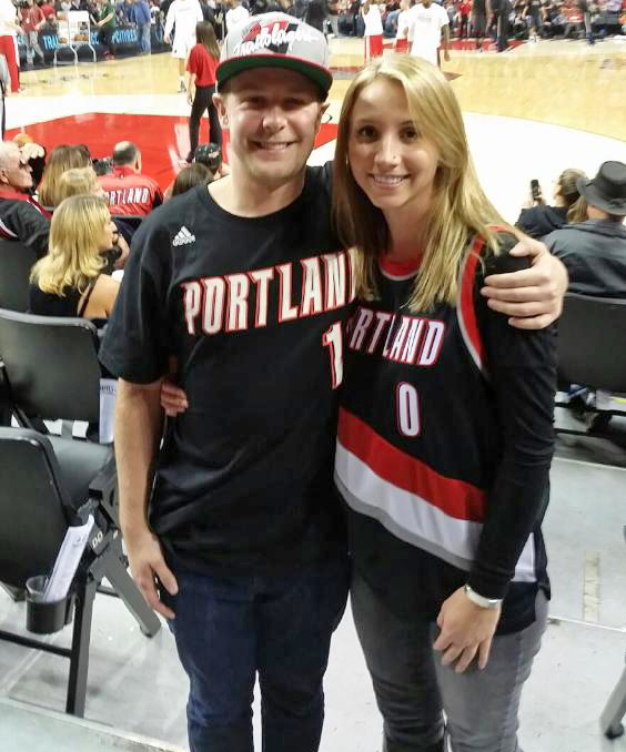 nick wilkins and his wife at a blazers game