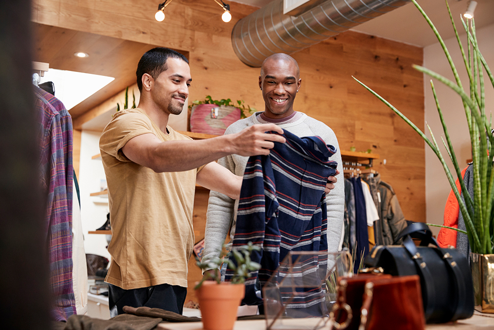 two guys doing some clothes shopping at a small business mens specialty shop