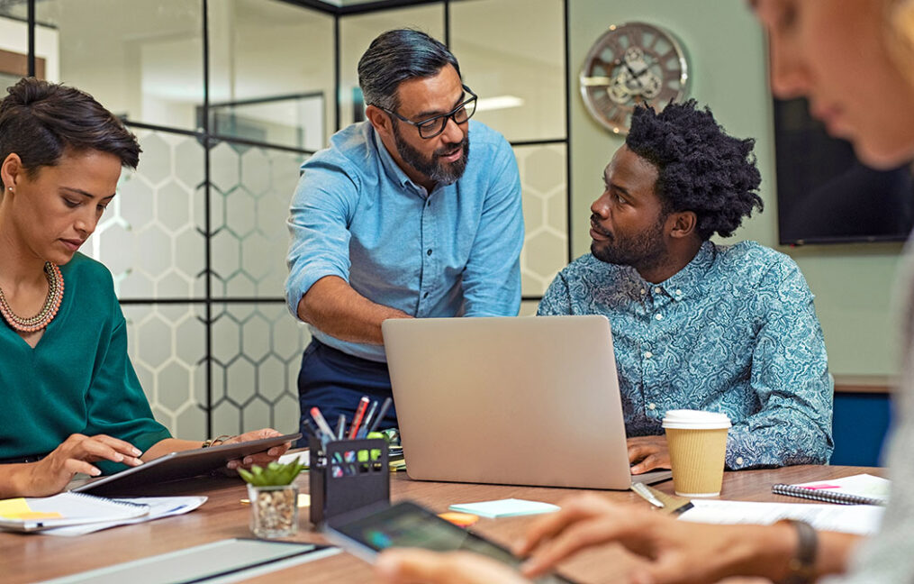 Professionals collaborate and discuss next steps