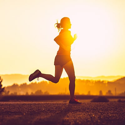 person running in the sunset