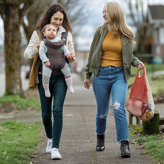 friends walking with baby