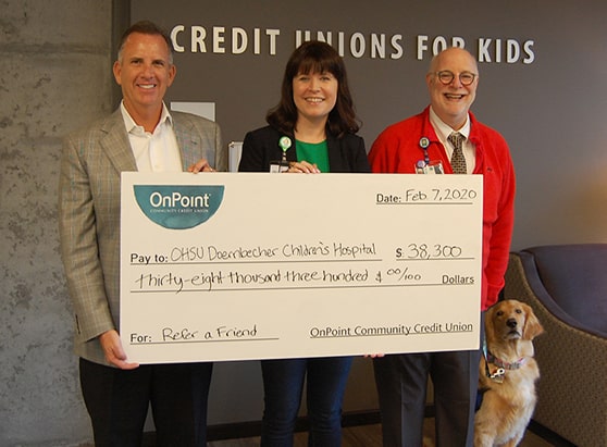 community giving-childrens miracle network - credit union for kids donation with OnPoint exec and team member