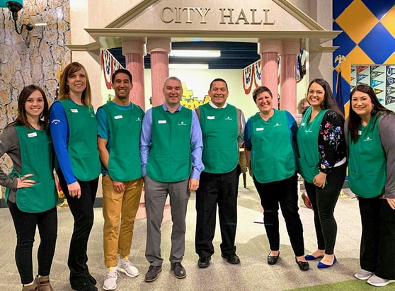 community giving-junior achievement onpoint team at financial education event biztown