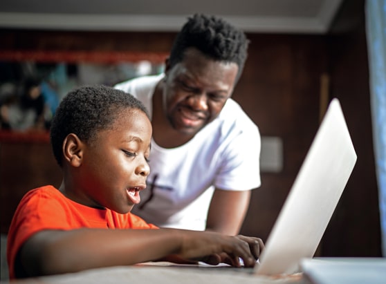 father and son using financial education resources