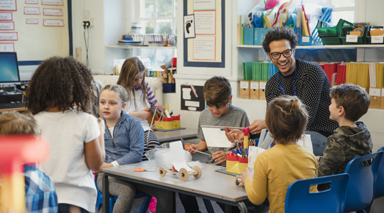 group of students working on an engineering project in their classroom