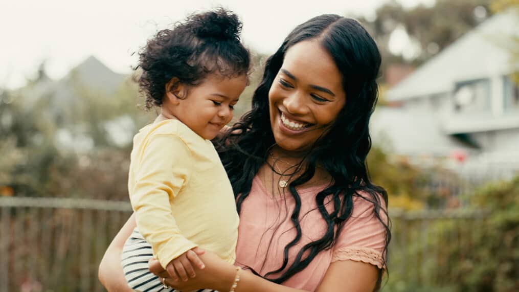 Mother holding daughter