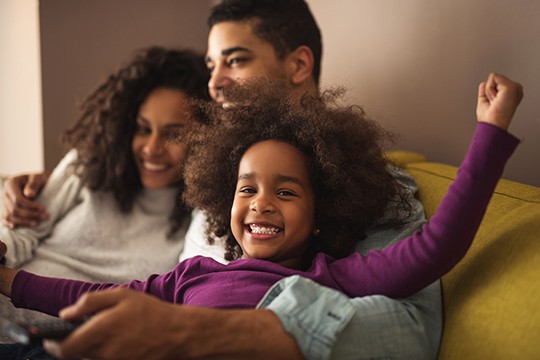 family-at-home-on-sofa