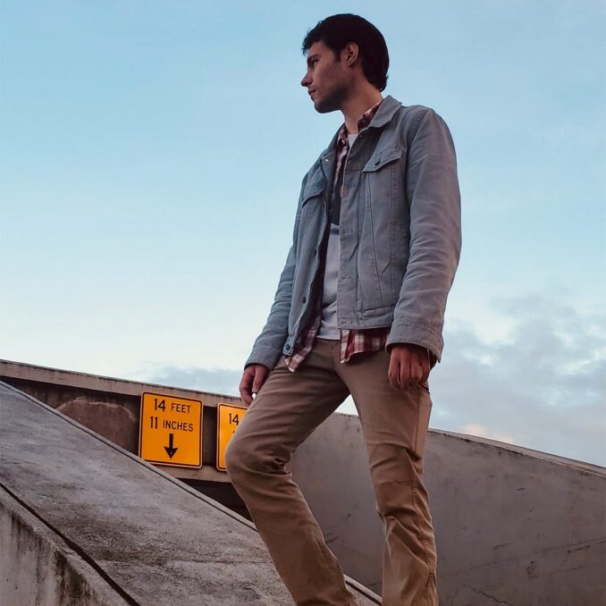 young-man-looking-outside