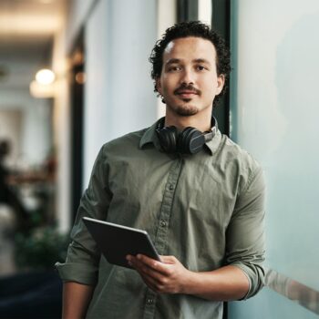 handsome young businessman standing in the office