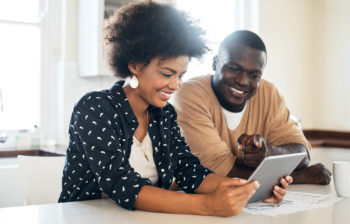couple looking at tablet