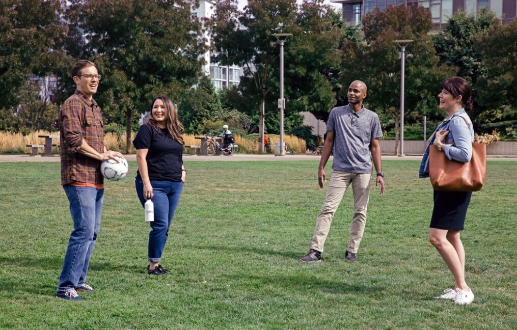 Join page-Fields Park downtown portland-group of friends hanging out in the park talking about local banking options