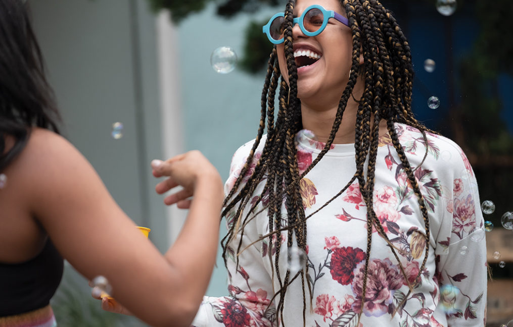 smiling woman laughing with friend
