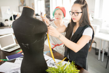 Two Creative Young Women in Workshop