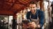 small business owner looking at a tablet at his brewery